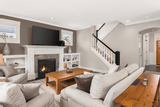 Heatilator Novus 36 inch gas fireplace installed in a living room with a white mantel surround